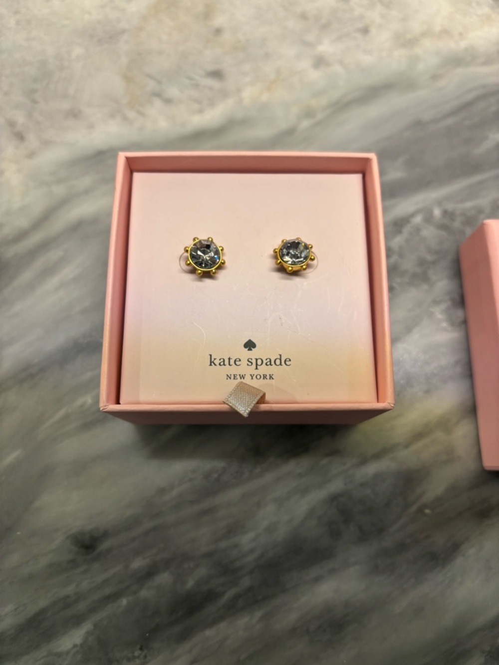 Kate Spade New York Flying Colors Bezel Studs in gold and clear.